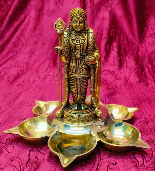 Brass oil lamp with statue of Lord Murugan